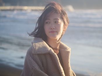 Portrait of beautiful young woman at beach