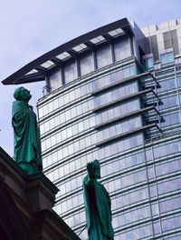 Low angle view of statue against building