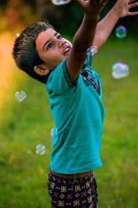 My small child playing on the garden