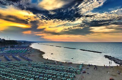 High angle view of beach against sky during sunset