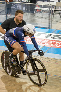 Young man riding bicycle