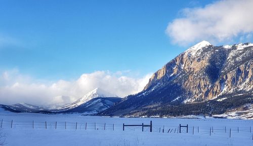 Snow covered mountains against sky