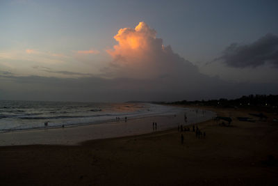 Scenic view of beach against sky during sunset