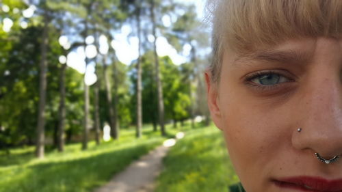 Cropped image of woman against trees