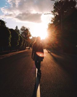 Woman walking on road