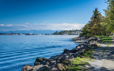 Majestic mount rainier towers over the ruston shoreline near tacoma, washington.