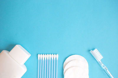 High angle view of cleaning equipment against blue background