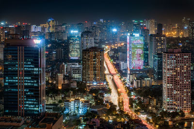 High angle view of illuminated city buildings at night
