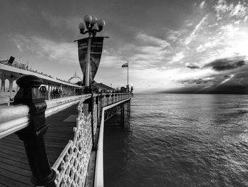 Bridge over sea against sky