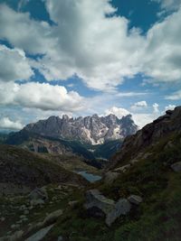 Scenic view of mountains against cloudy sky