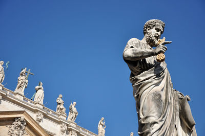 Statue of saint peter holding a key. vatican city