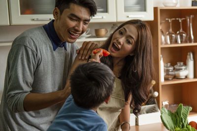 Side view of siblings playing at home