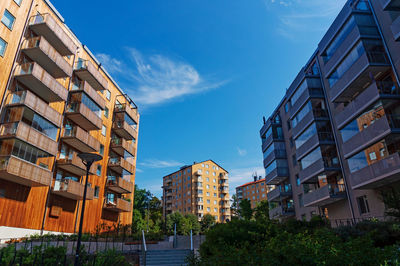 Low angle view of buildings against blue sky