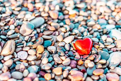 Close-up of heart shape with pebbles