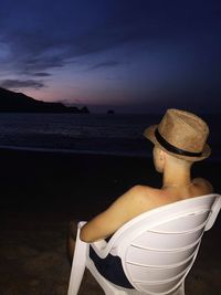 Man looking at sea against sky