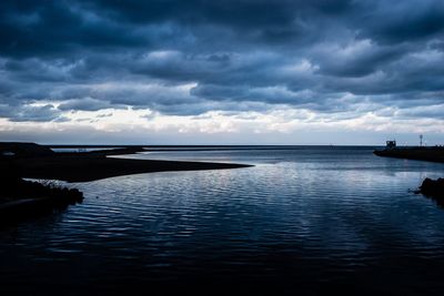 Scenic view of sea against sky at dusk