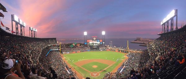 Panoramic view of crowd playing in city against sky