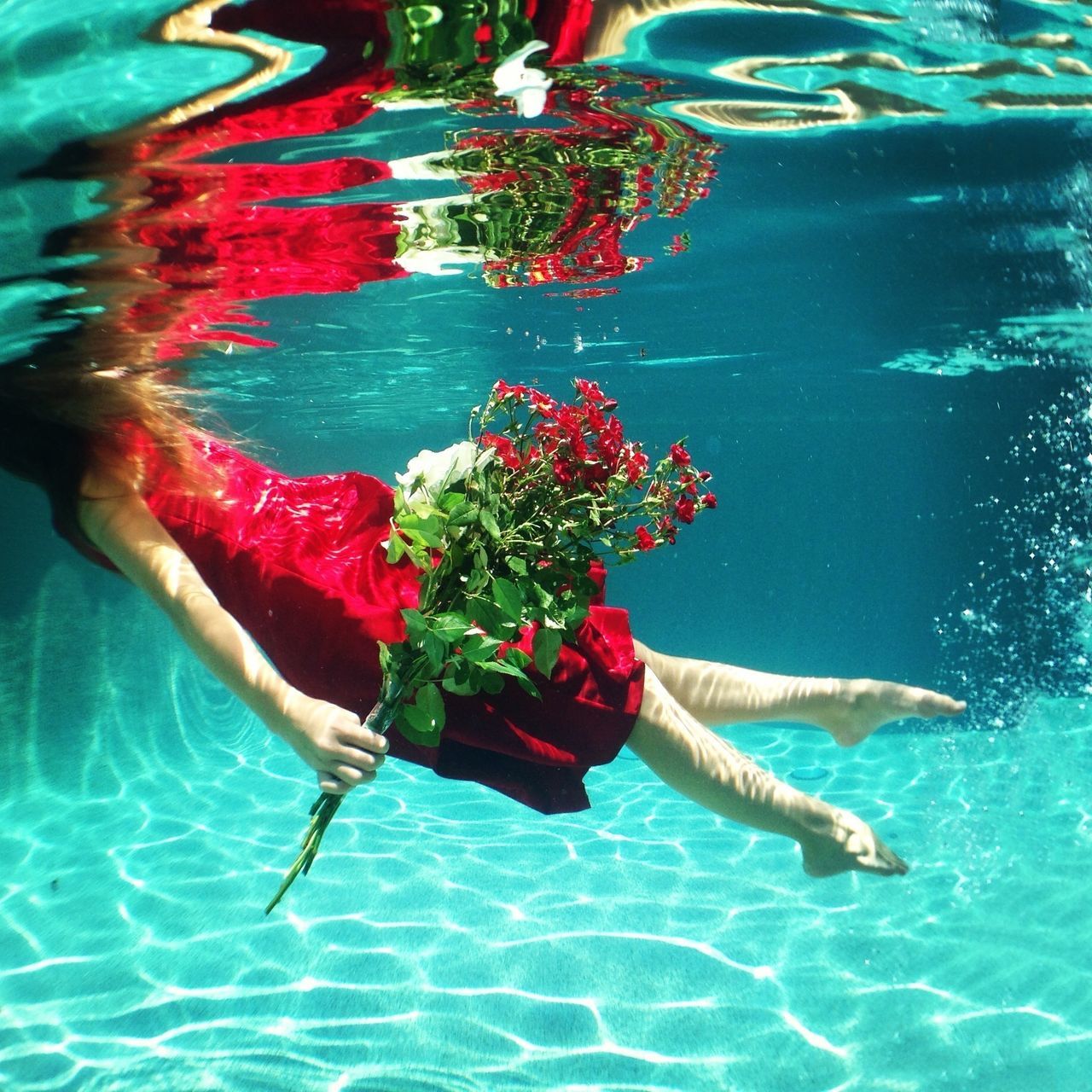 water, blue, swimming pool, underwater, swimming, indoors, waterfront, high angle view, reflection, fish, rippled, full length, transparent, multi colored, turquoise colored, leisure activity, sea, day