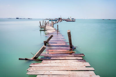 Pier over sea against sky