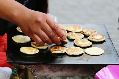 Close-up of man preparing food