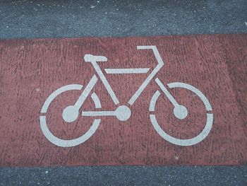 High angle view of bicycle sign on road