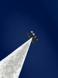 Low angle view of sculpture against clear blue sky