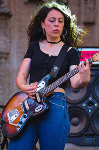 Young woman playing guitar