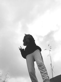 A girl of slavic appearance against the sky, black and white photo