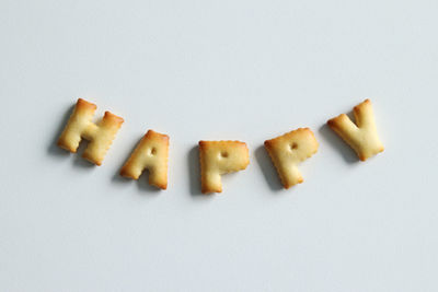 Close-up of cookies against white background