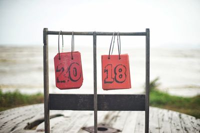 Close-up of number tags hanging on boat