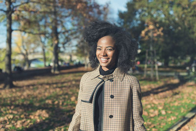 Beautiful african american woman in autumn park