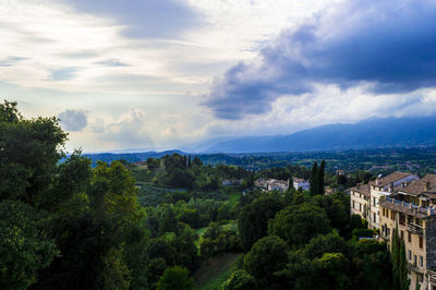 High angle view of trees and buildings against sky