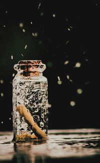 Close-up of glass jar on table