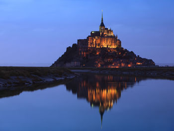 Night view of the famous mont saint michel abbey in normandy, france.