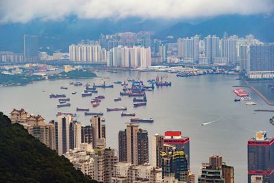 Aerial view of city and buildings against sky