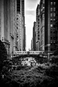 Panoramic shot of buildings and subway bw