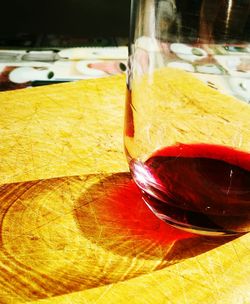 Close-up of red wine in glass on table