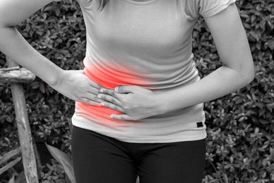 Midsection of woman wearing hat