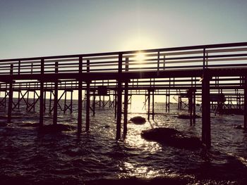 Pier at sea against sky