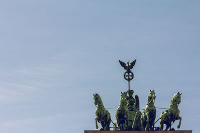 Low angle view of statue against sky