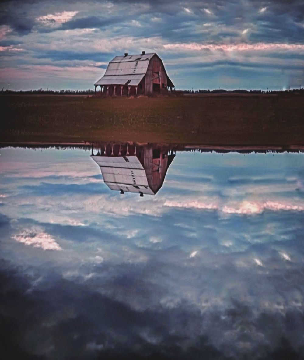 REFLECTION OF CLOUDY SKY ON WATER