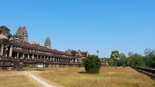 Exterior of temple against clear blue sky