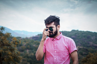 Close-up of young man wearing sunglasses