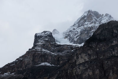 Scenic view of snow covered mountains against sky