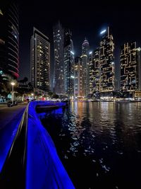 Illuminated buildings in city at night