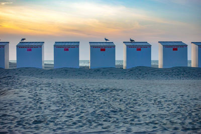 Scenic view of beach against sky during sunset