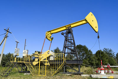 Oil drill against clear sky