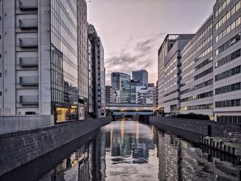 Canal amidst buildings in city