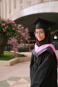 Portrait of woman in graduation gown