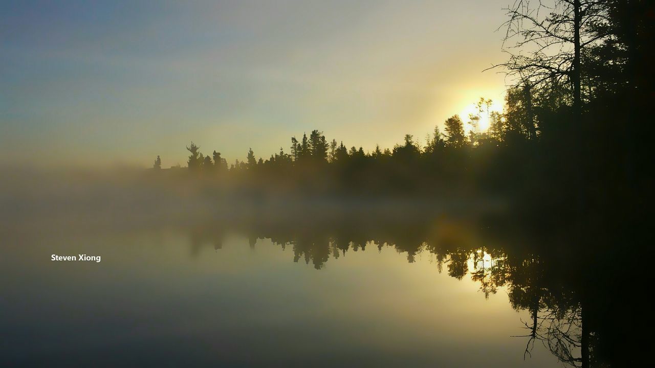 SCENIC VIEW OF LAKE AT SUNSET